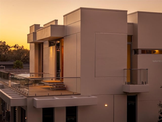 view of outdoor building at dusk