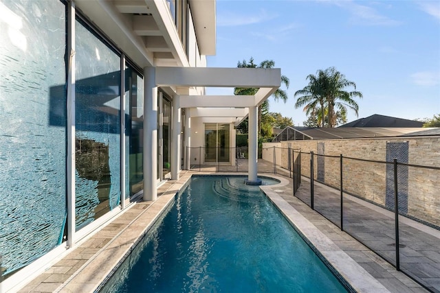 view of swimming pool featuring a water view