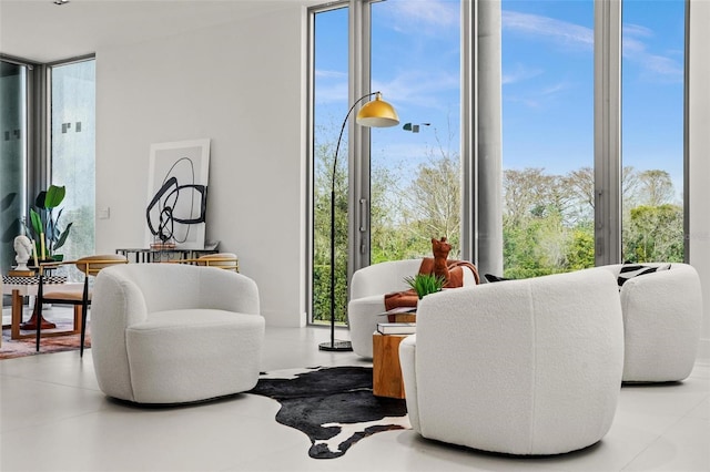 sitting room with floor to ceiling windows