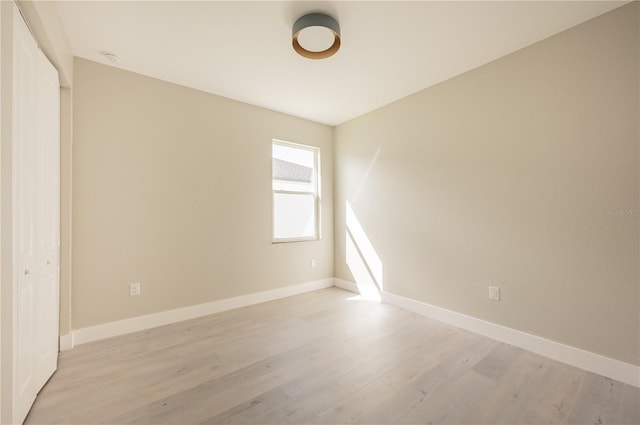 unfurnished room featuring light wood-type flooring