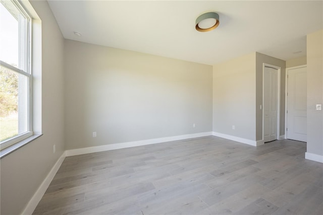 unfurnished room featuring light wood-type flooring