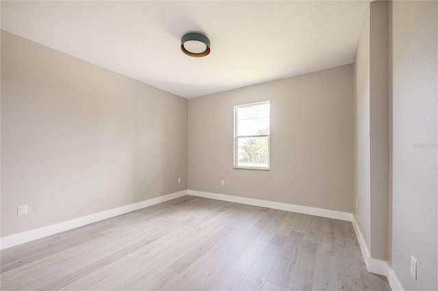 spare room featuring light hardwood / wood-style floors