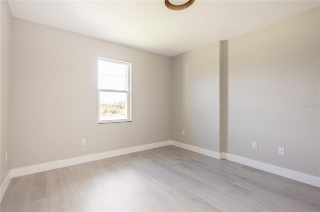 unfurnished room with light wood-type flooring