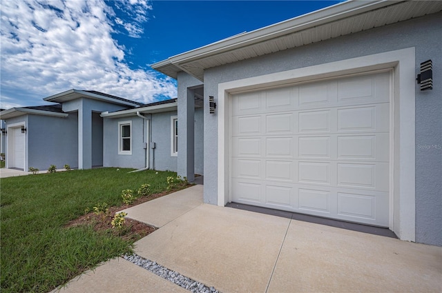 single story home featuring a front yard and a garage