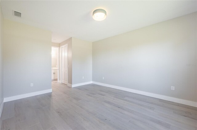 empty room with light wood-type flooring