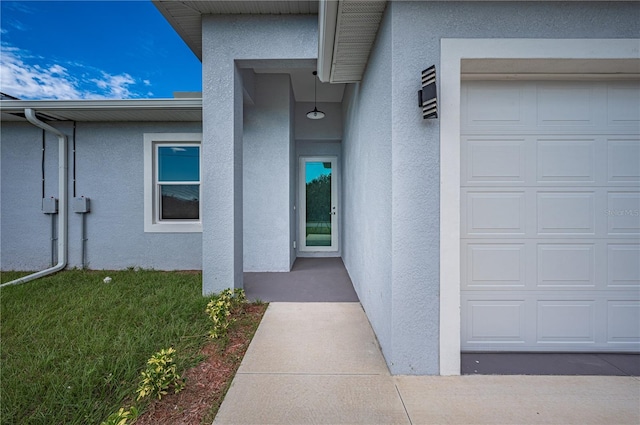 doorway to property featuring a garage