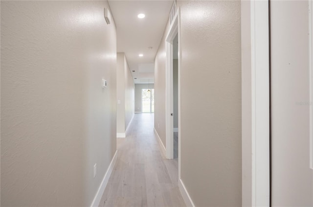 hall with light wood-type flooring