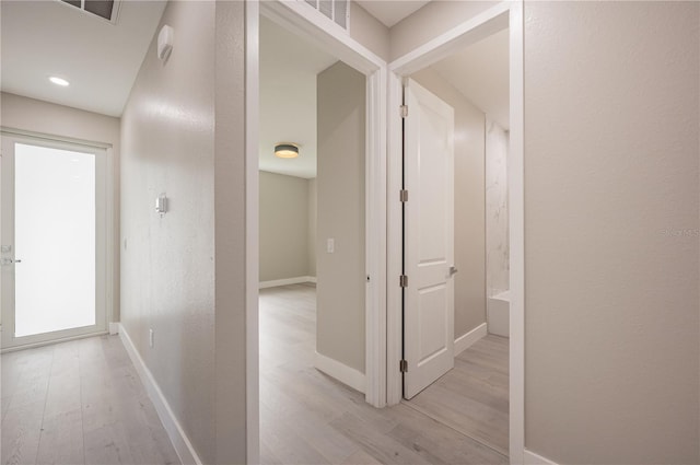 hallway featuring light hardwood / wood-style flooring