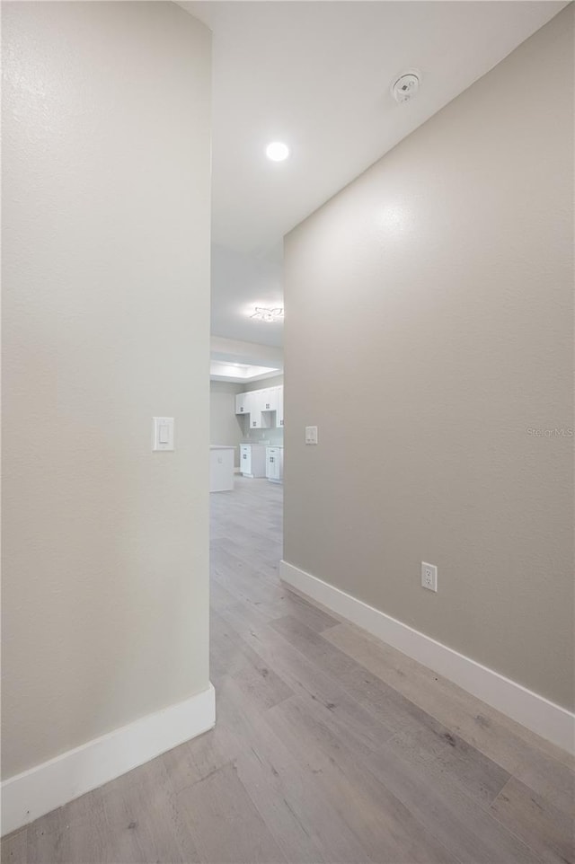 corridor featuring light hardwood / wood-style flooring