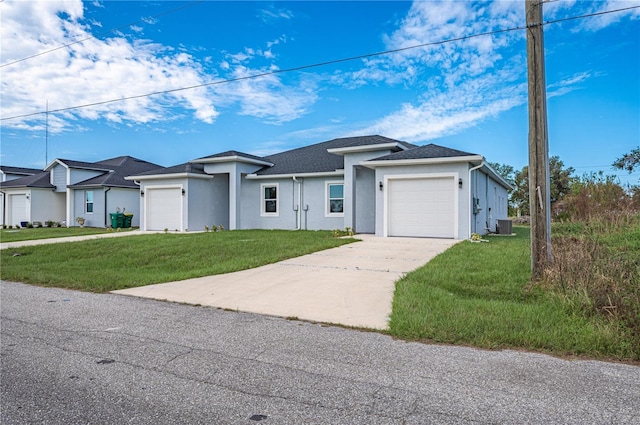 single story home with cooling unit, a garage, and a front yard