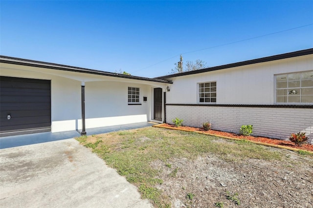 ranch-style home with a garage