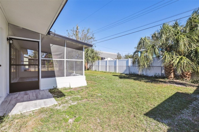 view of yard with a sunroom