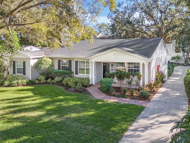 ranch-style home featuring a front lawn