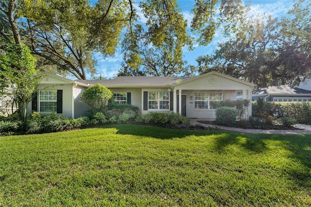 single story home with a front yard