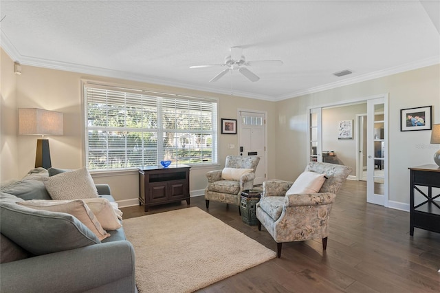 living room with ceiling fan, french doors, dark wood-type flooring, crown molding, and a textured ceiling