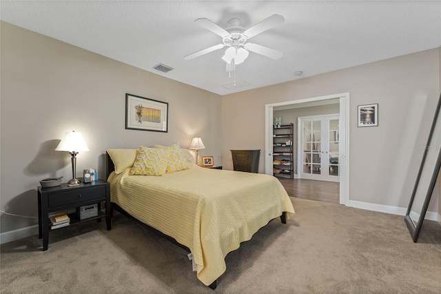 bedroom with carpet, french doors, a textured ceiling, and ceiling fan