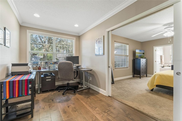 office area featuring hardwood / wood-style flooring, ceiling fan, crown molding, and a textured ceiling