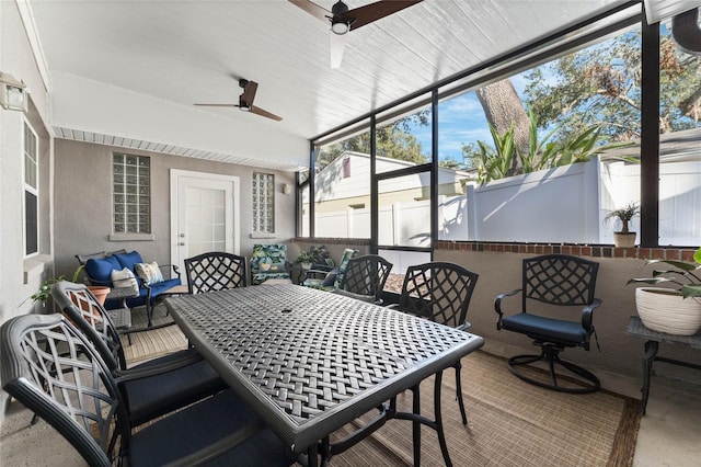 sunroom / solarium with ceiling fan