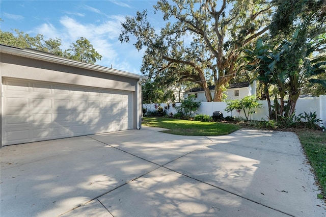 garage featuring a lawn