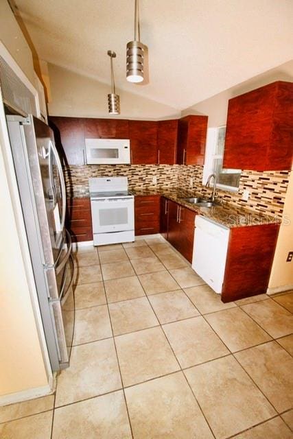 kitchen featuring pendant lighting, white appliances, backsplash, sink, and vaulted ceiling