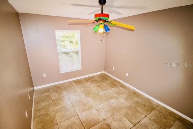 spare room featuring ceiling fan