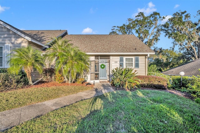 view of front of home with a front lawn