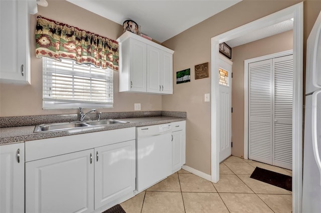 kitchen featuring white cabinetry, dishwasher, plenty of natural light, and sink