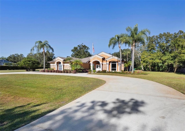 ranch-style house featuring a front lawn