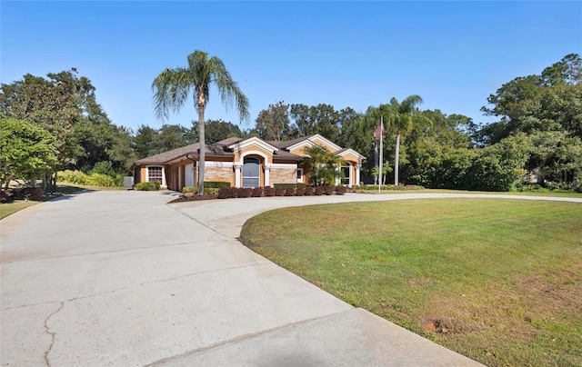 ranch-style home with a front yard