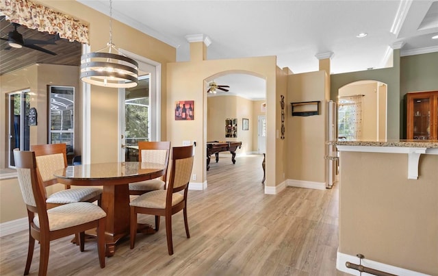 dining area featuring a wealth of natural light, light hardwood / wood-style flooring, pool table, and ornamental molding