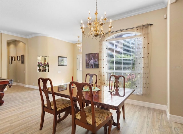 dining space featuring a chandelier, ornamental molding, pool table, and light hardwood / wood-style flooring