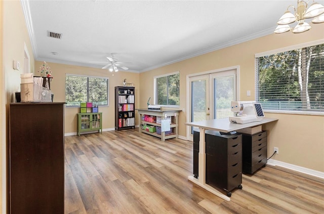 interior space with light hardwood / wood-style floors, crown molding, and french doors