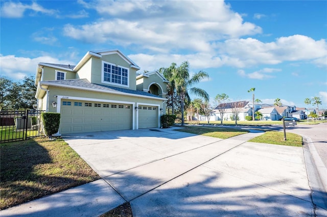 view of front of house featuring a front yard and a garage