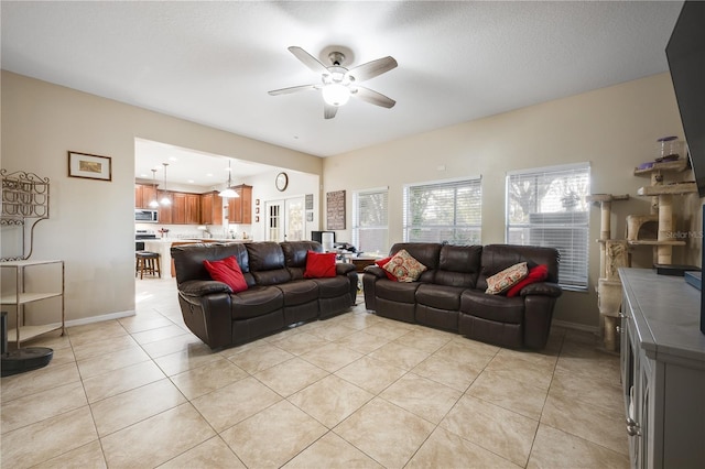 tiled living room featuring ceiling fan