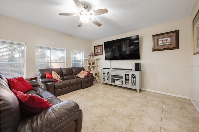 living room with ceiling fan and light tile patterned flooring