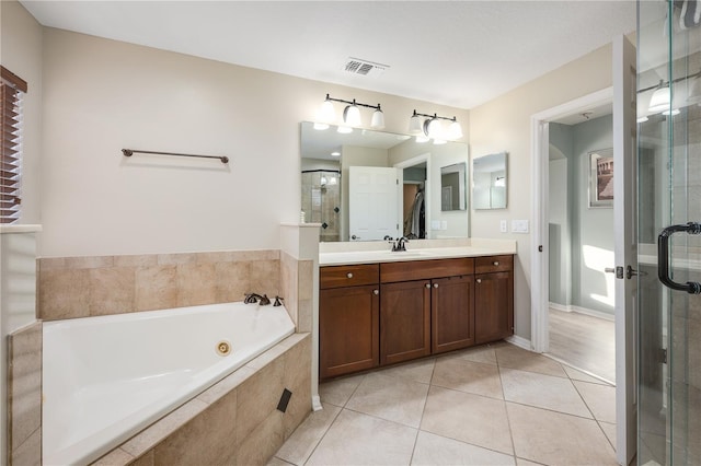 bathroom with tile patterned floors, vanity, and plus walk in shower