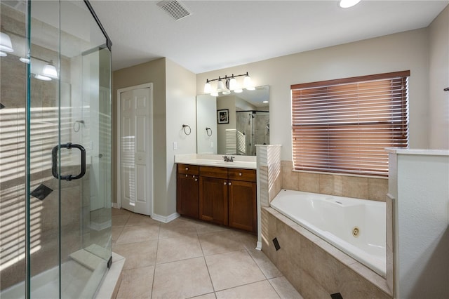 bathroom featuring separate shower and tub, tile patterned flooring, and vanity