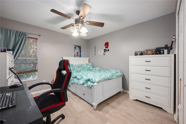 bedroom featuring ceiling fan and light hardwood / wood-style flooring