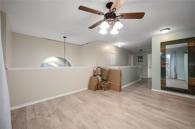 unfurnished room with ceiling fan and light hardwood / wood-style flooring