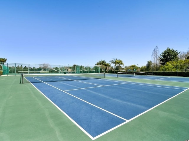 view of sport court featuring basketball hoop