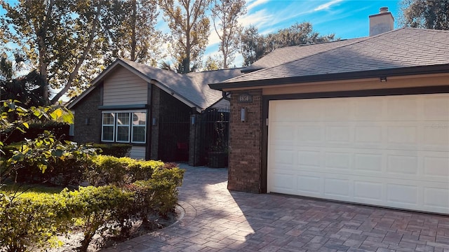 single story home with a garage