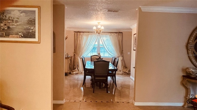 tiled dining room with a notable chandelier, ornamental molding, and a textured ceiling