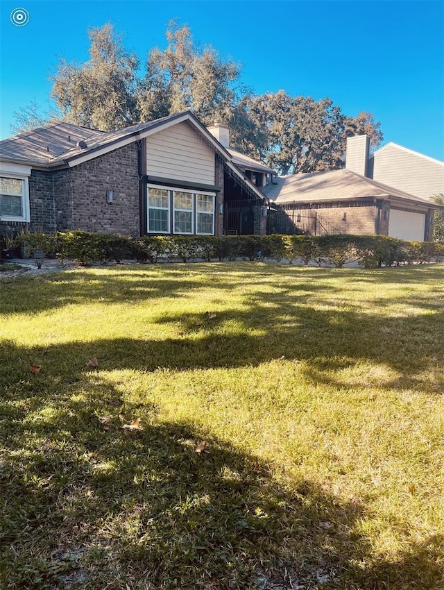 exterior space with a garage and a front yard