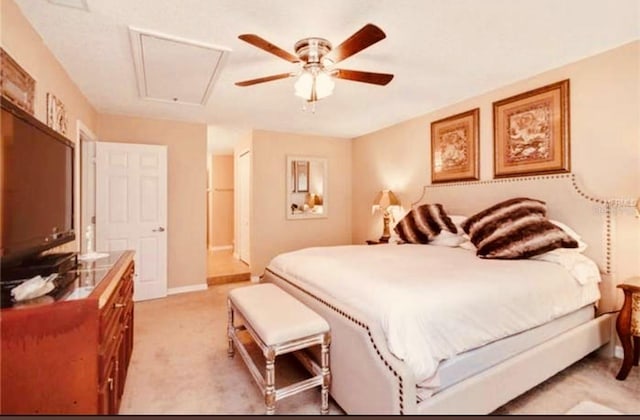 bedroom featuring light colored carpet and ceiling fan