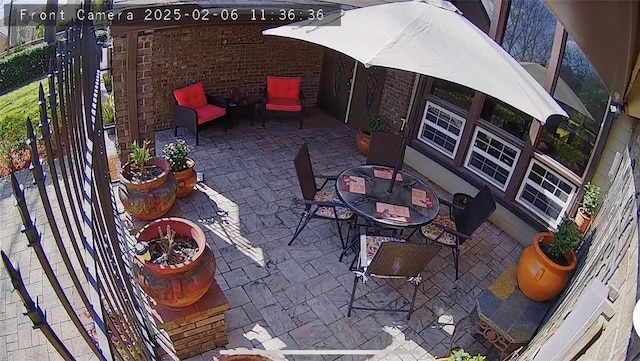 view of patio / terrace featuring an outdoor fire pit