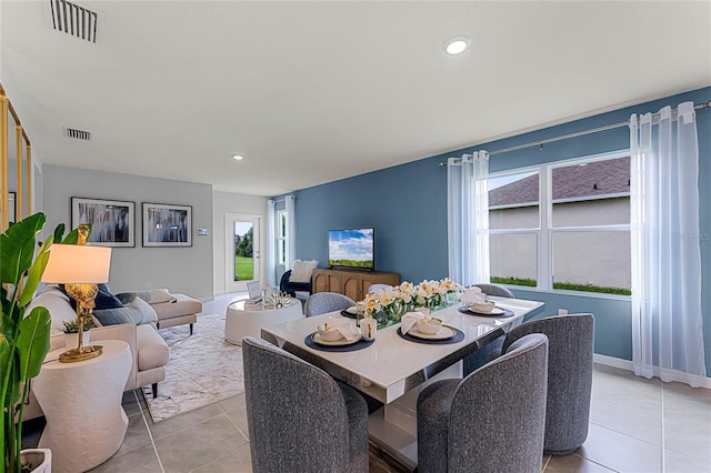 dining area featuring light tile patterned floors