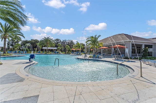 view of swimming pool featuring a patio