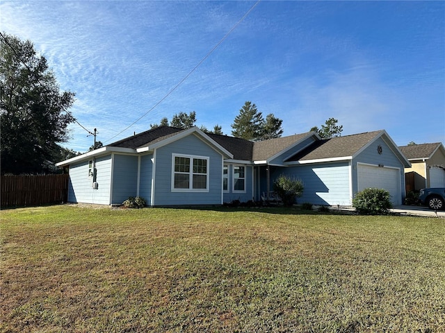 single story home featuring a front yard and a garage