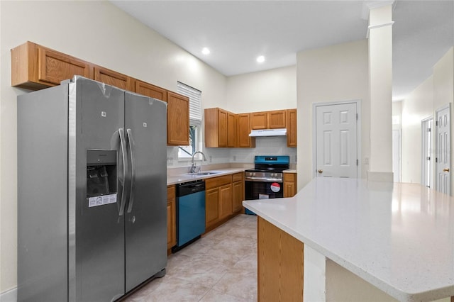 kitchen with sink, light tile patterned floors, stainless steel appliances, and a high ceiling