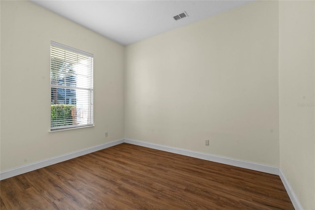 empty room featuring dark wood-type flooring